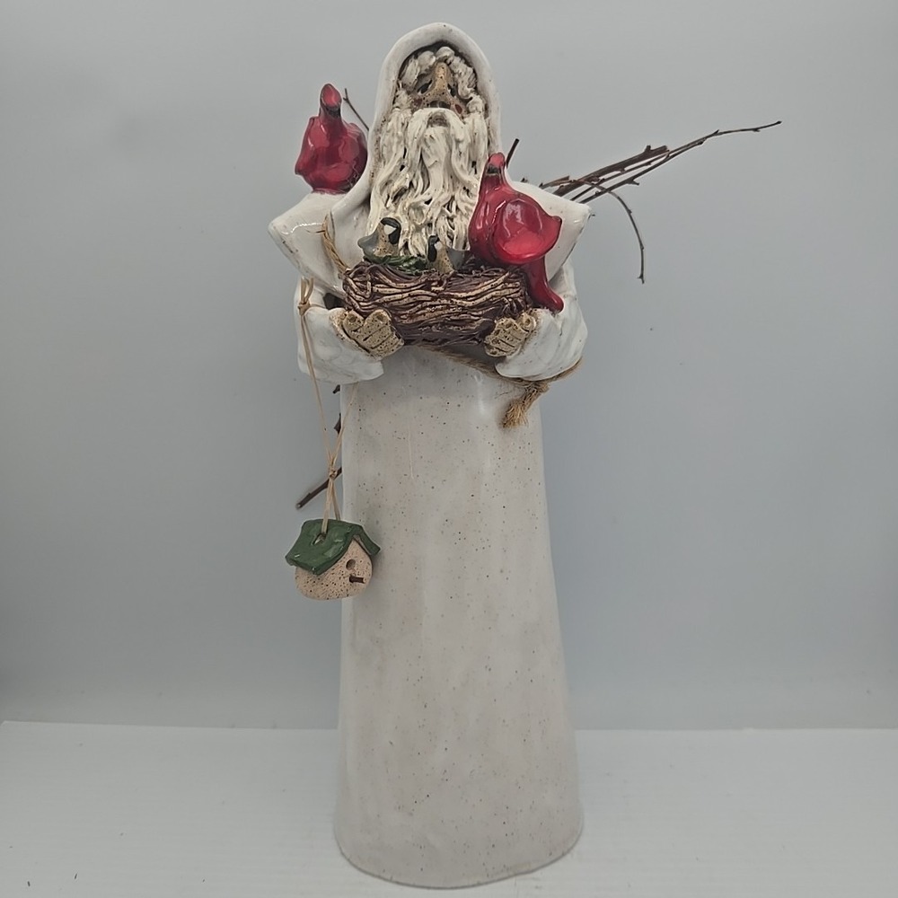Tall White Coat‎ Santa Holding Cardinals And Bird Nest